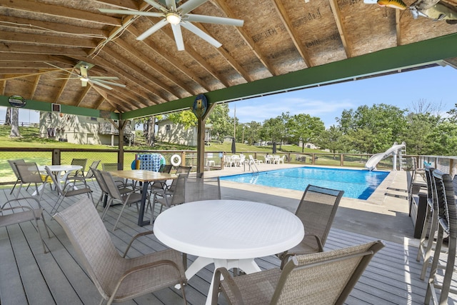 638 Double Day, Branson West, MO 65737 - community pool with a water slide, ceiling fan, outdoor dining space, a wooden deck, and a gazebo