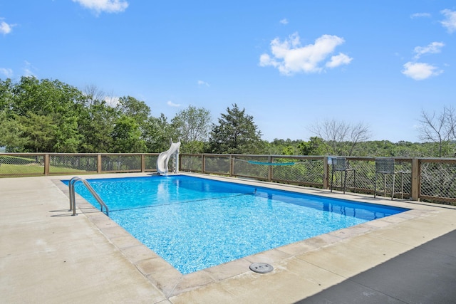 638 Double Day, Branson West, MO 65737 - view of swimming pool with a water slide and view of wooded area