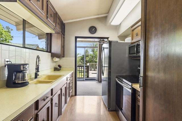 638 Double Day, Branson West, MO 65737 - kitchen featuring stainless steel appliances, a sink, tasteful backsplash, light countertops, and vaulted ceiling