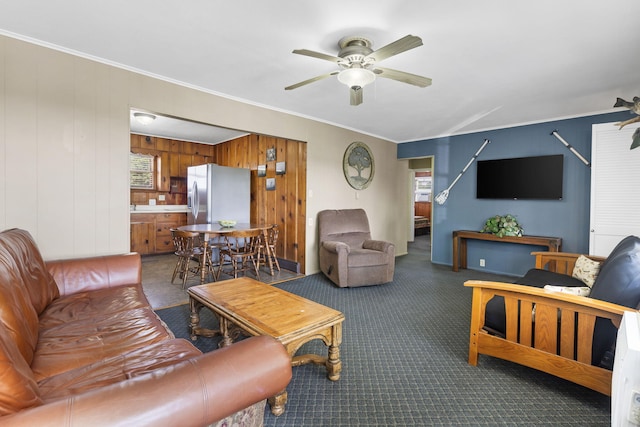 638 Double Day, Branson West, MO 65737 - carpeted living room with a ceiling fan, crown molding, and wooden walls