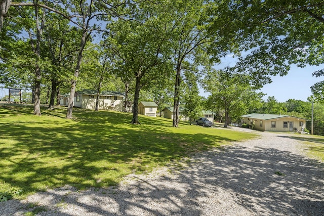 638 Double Day, Branson West, MO 65737 - view of green lawn featuring driveway