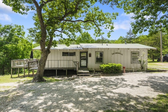638 Double Day, Branson West, MO 65737 - view of front of home with board and batten siding, a wooden deck, and metal roof