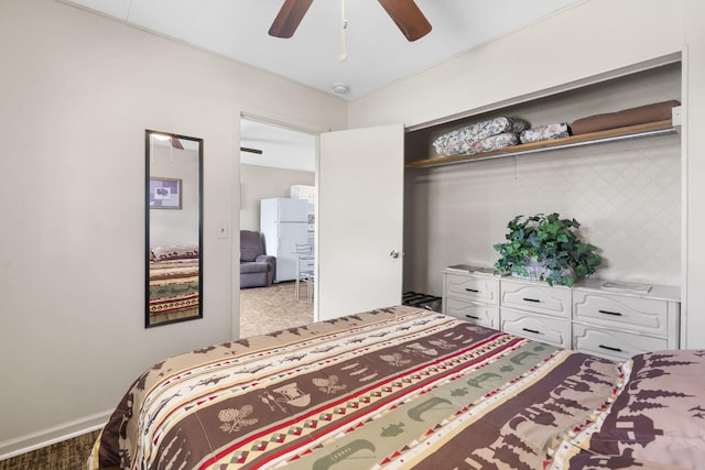 638 Double Day, Branson West, MO 65737 - carpeted bedroom featuring freestanding refrigerator, a ceiling fan, and a closet