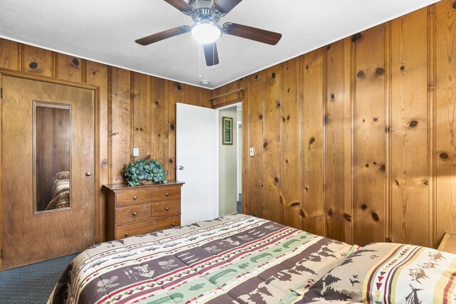 638 Double Day, Branson West, MO 65737 - carpeted bedroom featuring wooden walls and ceiling fan