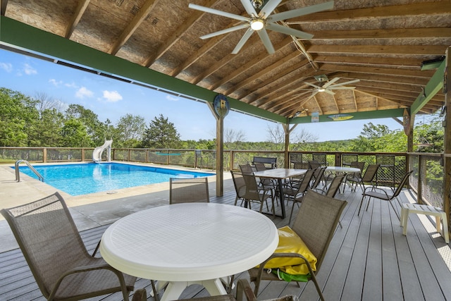 638 Double Day, Branson West, MO 65737 - view of pool featuring a ceiling fan, a water slide, and outdoor dining space