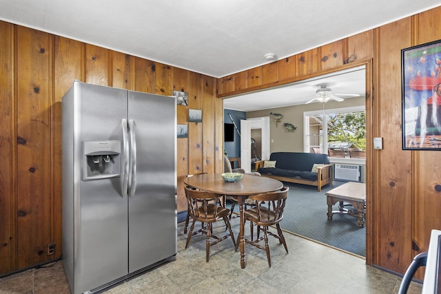 638 Double Day, Branson West, MO 65737 - kitchen featuring stainless steel refrigerator with ice dispenser, wooden walls, brown cabinetry, tile patterned floors, and a ceiling fan