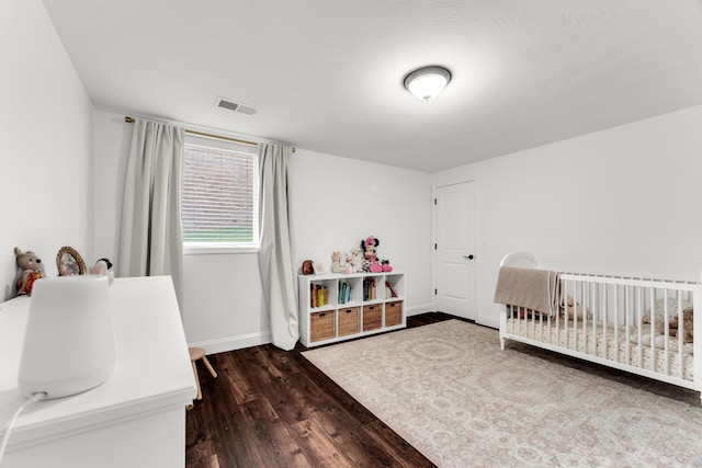 108 Island Green Dr, Republic, MO 65738 - bedroom with dark wood finished floors, baseboards, and a crib