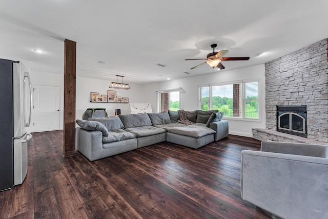 108 Island Green Dr, Republic, MO 65738 - living area featuring dark wood-style floors, a ceiling fan, and a stone fireplace