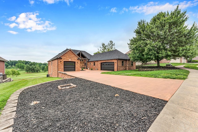 108 Island Green Dr, Republic, MO 65738 - view of front of home featuring brick siding, a front lawn, a garage, and driveway