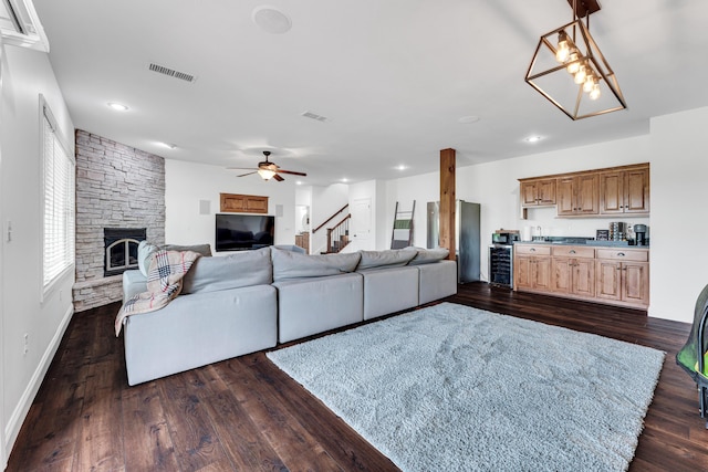 108 Island Green Dr, Republic, MO 65738 - living room featuring stairs, a fireplace, a ceiling fan, dark wood-style flooring, and wine cooler
