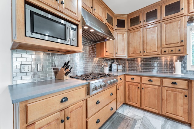 108 Island Green Dr, Republic, MO 65738 - kitchen with under cabinet range hood, stainless steel appliances, decorative backsplash, and light countertops