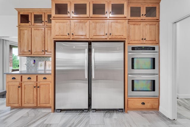 108 Island Green Dr, Republic, MO 65738 - kitchen with stainless steel appliances, glass insert cabinets, backsplash, and baseboards