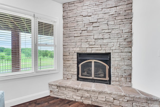 108 Island Green Dr, Republic, MO 65738 - detailed view of wood finished floors, baseboards, and a fireplace