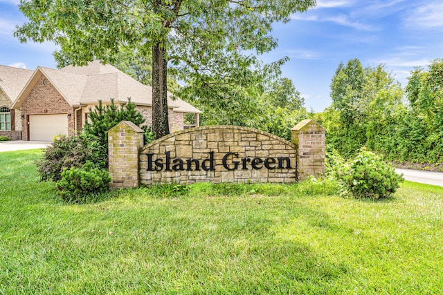 108 Island Green Dr, Republic, MO 65738 - community sign featuring an attached garage, a lawn, and concrete driveway