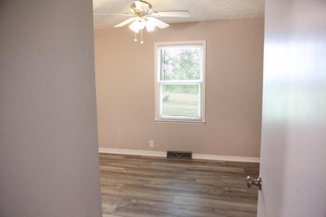 18627 Farm Rd Unit 1075, Exeter, MO 65647 - unfurnished room with a ceiling fan, wood finished floors, and baseboards
