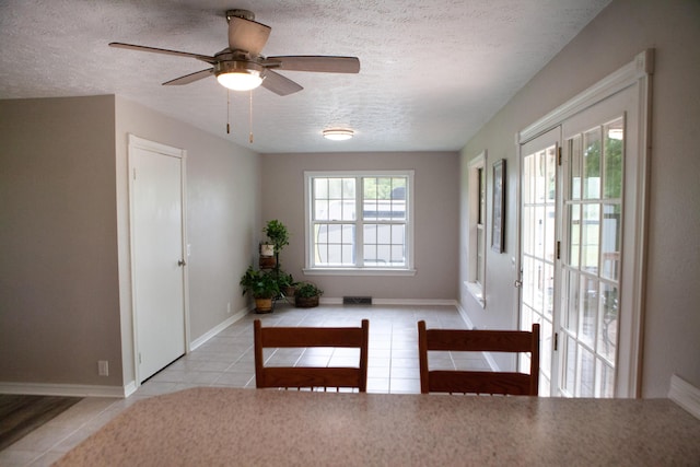 18627 Farm Rd Unit 1075, Exeter, MO 65647 - doorway to outside featuring a textured ceiling, tile patterned floors, a ceiling fan, and baseboards