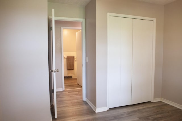 18627 Farm Rd Unit 1075, Exeter, MO 65647 - unfurnished bedroom featuring wood finished floors, baseboards, and a closet