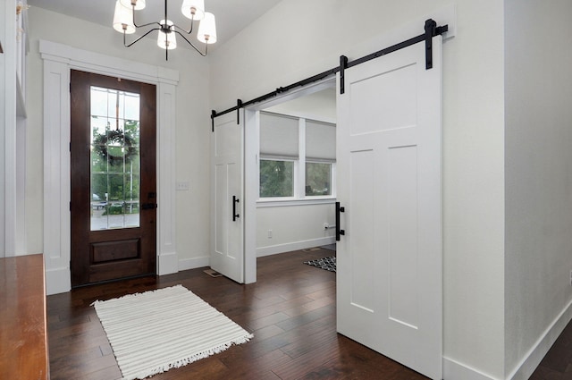 498 Mockingbird, Rogersville, MO 65742 - entrance foyer featuring a barn door, a chandelier, baseboards, and dark wood-type flooring