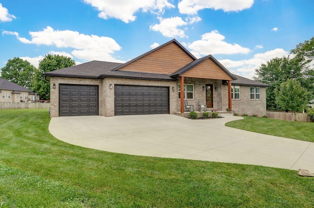 498 Mockingbird, Rogersville, MO 65742 - view of front of property featuring an attached garage, concrete driveway, brick siding, and roof with shingles
