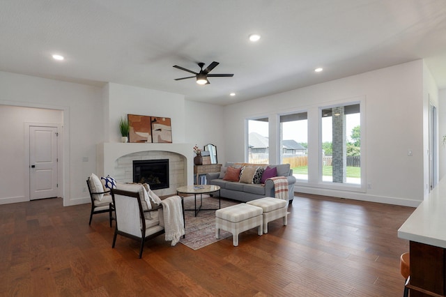 1756 N Marlowe Ave, Springfield, MO 65802 - living area featuring ceiling fan, dark wood finished floors, a tiled fireplace, recessed lighting, and baseboards