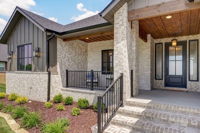 1756 N Marlowe Ave, Springfield, MO 65802 - property entrance featuring a porch, board and batten siding, brick siding, and a shingled roof