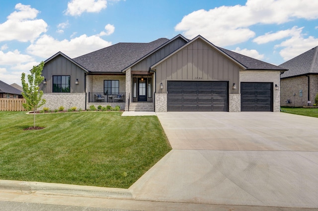 1756 N Marlowe Ave, Springfield, MO 65802 - modern farmhouse style home with board and batten siding, an attached garage, driveway, covered porch, and roof with shingles