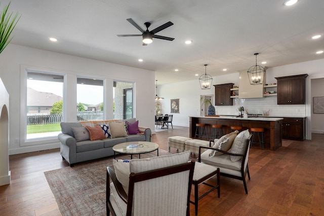 1756 N Marlowe Ave, Springfield, MO 65802 - living area featuring recessed lighting, a ceiling fan, dark wood finished floors, baseboards, and a chandelier