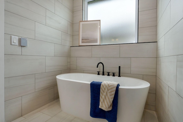 1756 N Marlowe Ave, Springfield, MO 65802 - bathroom featuring tile walls, a soaking tub, and tile patterned flooring