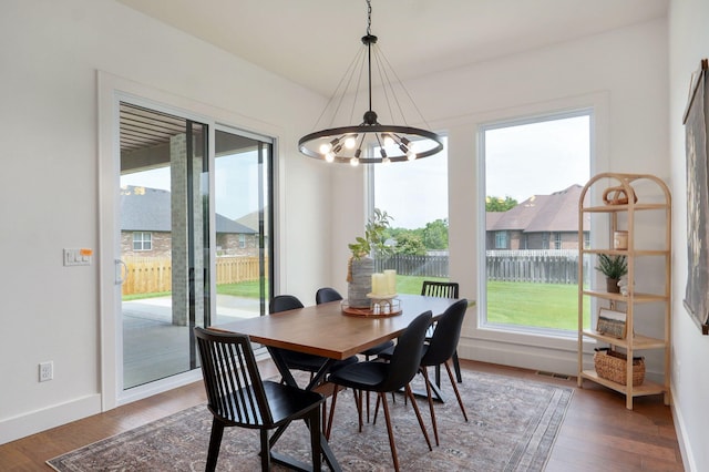 1756 N Marlowe Ave, Springfield, MO 65802 - dining area featuring a chandelier, baseboards, and wood finished floors