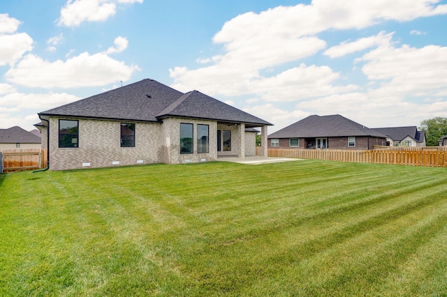 1756 N Marlowe Ave, Springfield, MO 65802 - back of house featuring a patio area, roof with shingles, and brick siding