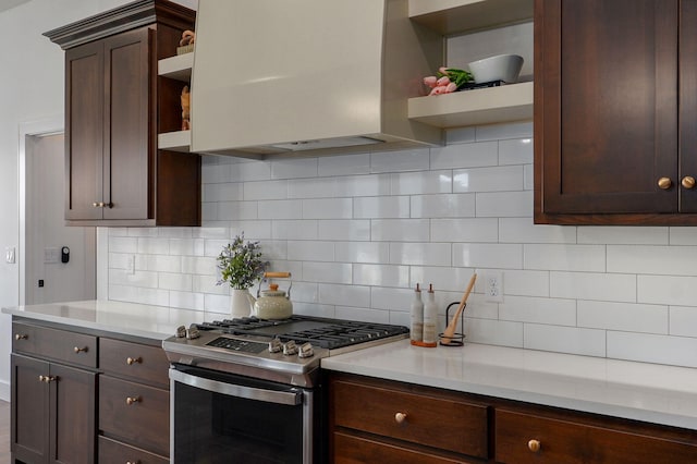 1756 N Marlowe Ave, Springfield, MO 65802 - kitchen with open shelves, gas range, wall chimney range hood, dark brown cabinets, and light countertops
