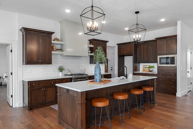 1756 N Marlowe Ave, Springfield, MO 65802 - kitchen with open shelves, stainless steel appliances, a chandelier, dark wood-style flooring, and recessed lighting