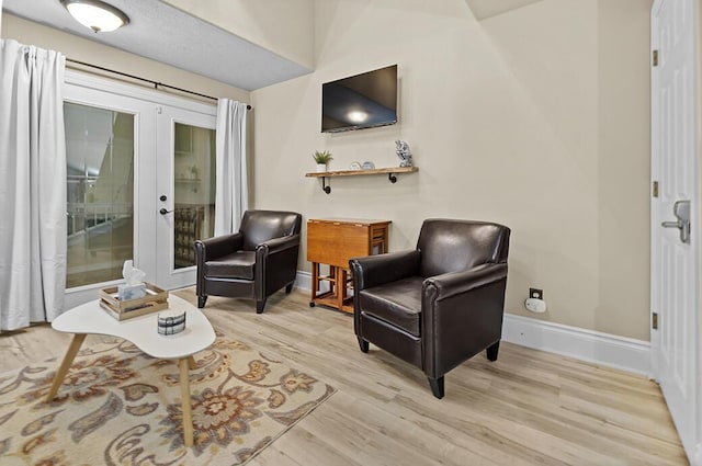 180 Grace Chapel Rd Unit 321, Blue Eye, MO 65611 - sitting room featuring french doors, light wood-type flooring, and baseboards