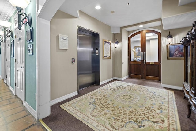180 Grace Chapel Rd Unit 321, Blue Eye, MO 65611 - foyer with arched walkways, elevator, baseboards, recessed lighting, and carpet