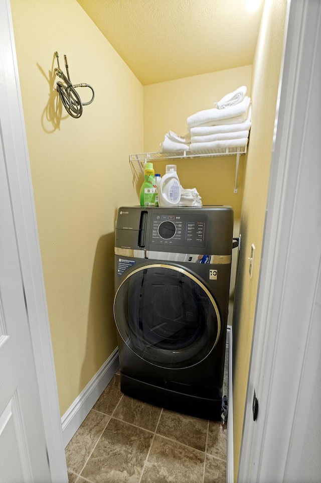 180 Grace Chapel Rd Unit 321, Blue Eye, MO 65611 - laundry room featuring washer / dryer and baseboards