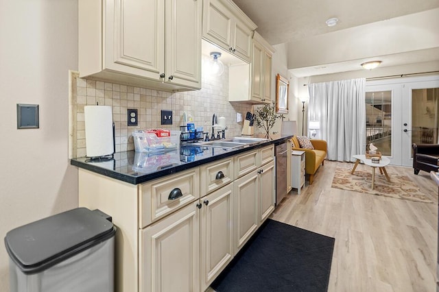 180 Grace Chapel Rd Unit 321, Blue Eye, MO 65611 - kitchen featuring stainless steel dishwasher, a sink, french doors, light wood-style floors, and cream cabinets