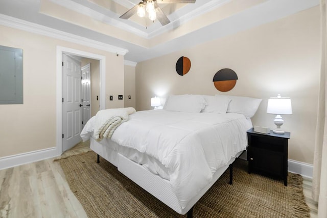 180 Grace Chapel Rd Unit 321, Blue Eye, MO 65611 - bedroom featuring crown molding, electric panel, wood finished floors, baseboards, and a tray ceiling