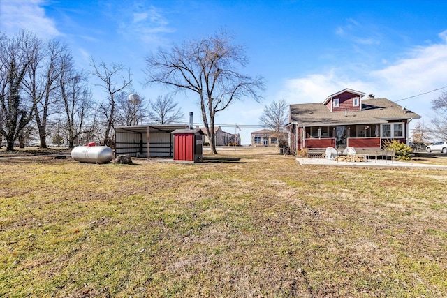 310 S Main St, Licking, MO 65542 - view of grassy yard with a carport and an outbuilding