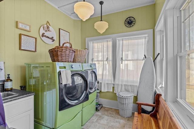 310 S Main St, Licking, MO 65542 - washroom with independent washer and dryer, plenty of natural light, crown molding, and light tile patterned floors
