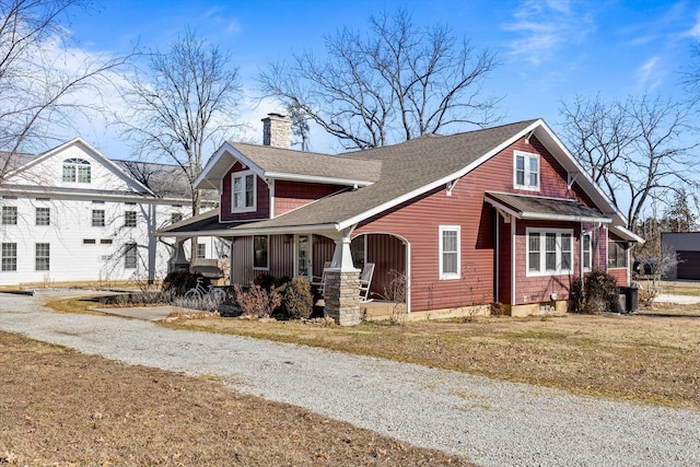 310 S Main St, Licking, MO 65542 - view of front facade with a porch, a chimney, a shingled roof, and driveway