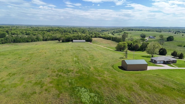 view of rural area with a heavily wooded area