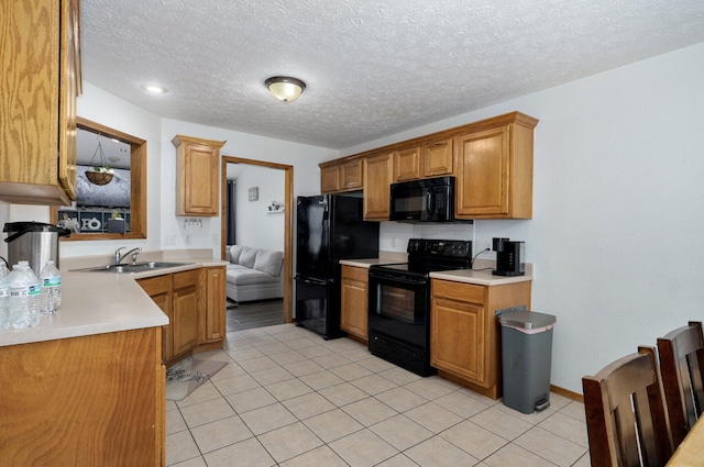 6004 N 6th Ave, Ozark, MO 65721 - kitchen with black appliances, a sink, light tile patterned floors, light countertops, and a textured ceiling