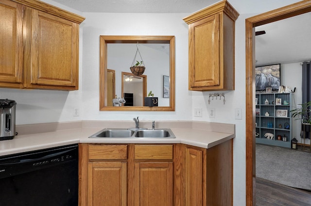 6004 N 6th Ave, Ozark, MO 65721 - kitchen featuring black dishwasher, a sink, light countertops, and wood finished floors