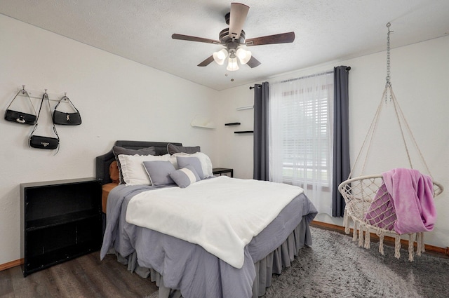 6004 N 6th Ave, Ozark, MO 65721 - bedroom featuring wood finished floors, baseboards, ceiling fan, and a textured ceiling