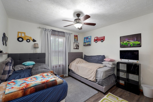 6004 N 6th Ave, Ozark, MO 65721 - bedroom featuring wood finished floors, a ceiling fan, and a textured ceiling