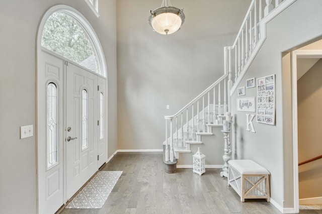 287 Appletree Dr, Ozark, MO 65721 - entrance foyer featuring stairway, wood finished floors, baseboards, and a towering ceiling