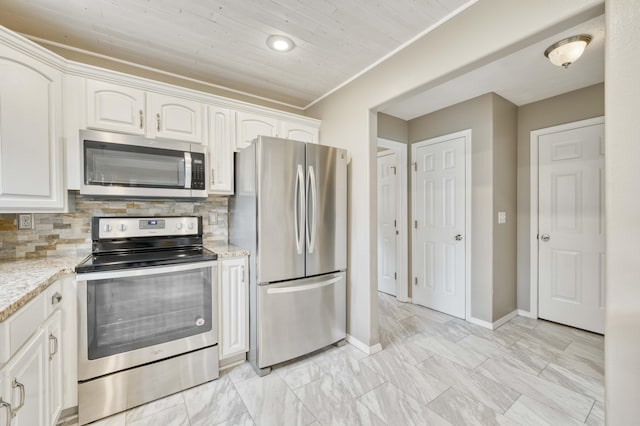 287 Appletree Dr, Ozark, MO 65721 - kitchen featuring appliances with stainless steel finishes, white cabinetry, baseboards, backsplash, and light marble finish flooring