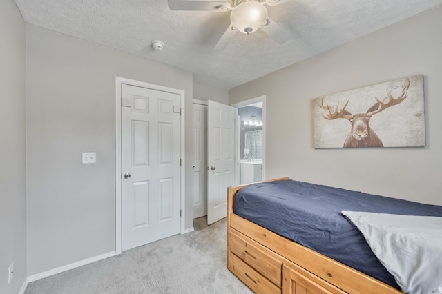 287 Appletree Dr, Ozark, MO 65721 - bedroom featuring light colored carpet, baseboards, ceiling fan, a textured ceiling, and ensuite bath