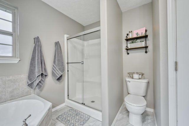 287 Appletree Dr, Ozark, MO 65721 - full bath featuring toilet, a stall shower, a bath, baseboards, and a textured ceiling