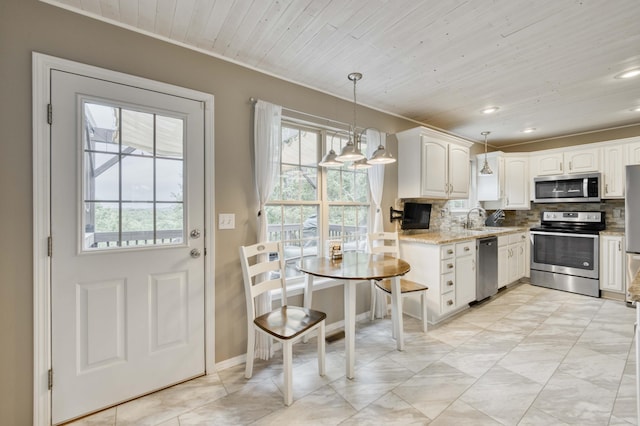 287 Appletree Dr, Ozark, MO 65721 - kitchen featuring stainless steel appliances, a sink, backsplash, light stone countertops, and white cabinetry